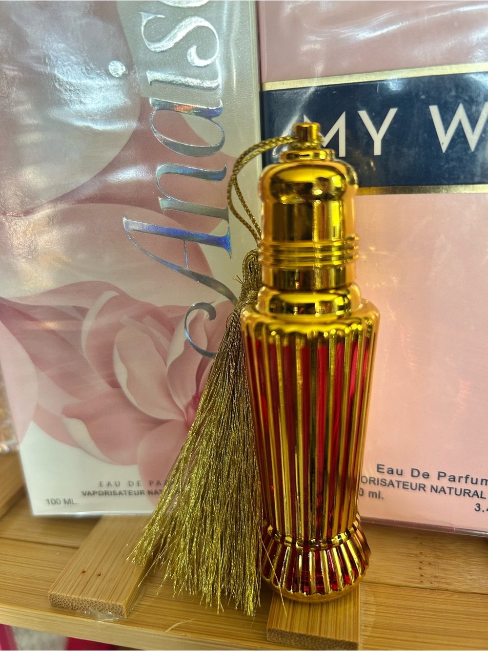 Rollerball glass perfume container.